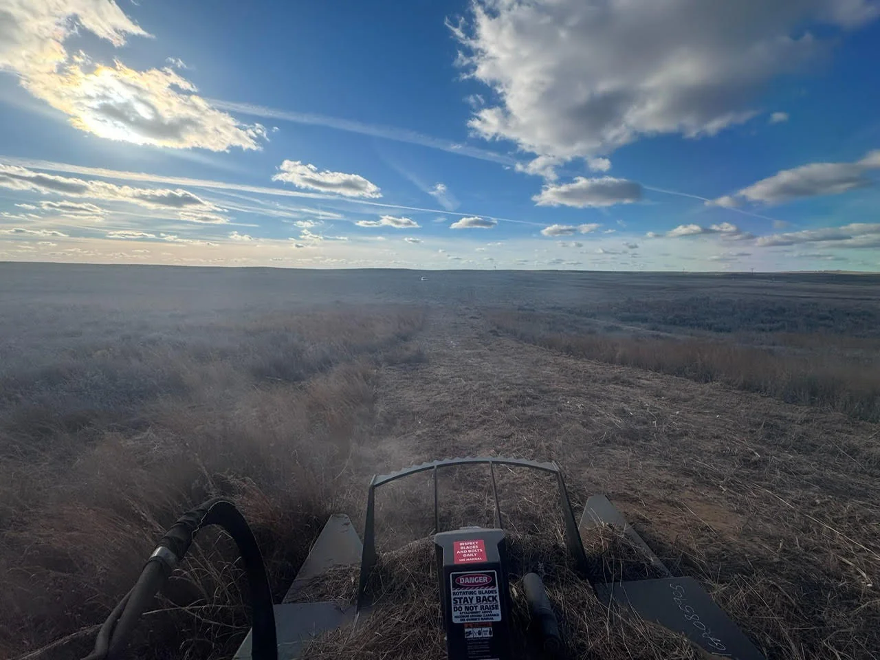 Aerial view of cleared land with excavation equipment and brush removal in Lawton, OK